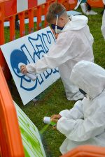 Photo of youngsters taking part in a 'have a go' street art session.