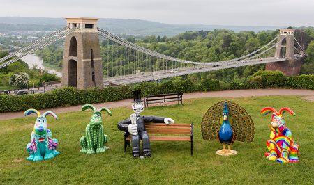 Photo of some of the Gromit Unleashed 2 sculpture trail figures with the Clifton Suspension Bridge in the background.