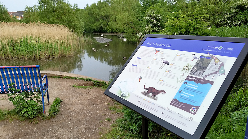 Photo of the interpretation panel at the lake.