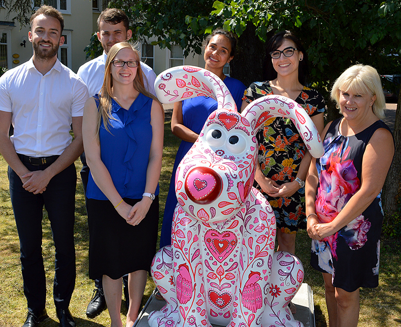 Photo of Dunkley's staff welcoming Cupid.