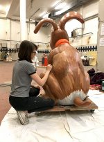 Photo of Hannah Bone painting the Rockin' Robin figure.