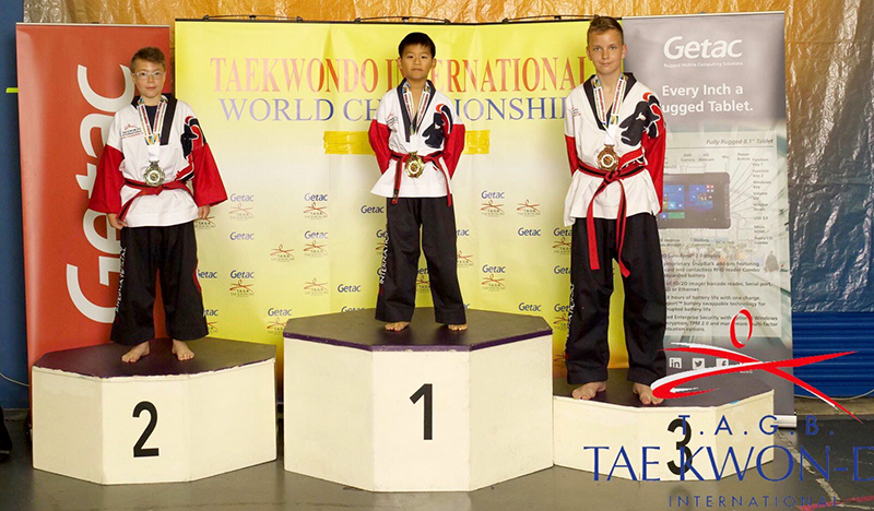 Photo of Nathan Wong on the podium at the Taekwondo International World Championships.