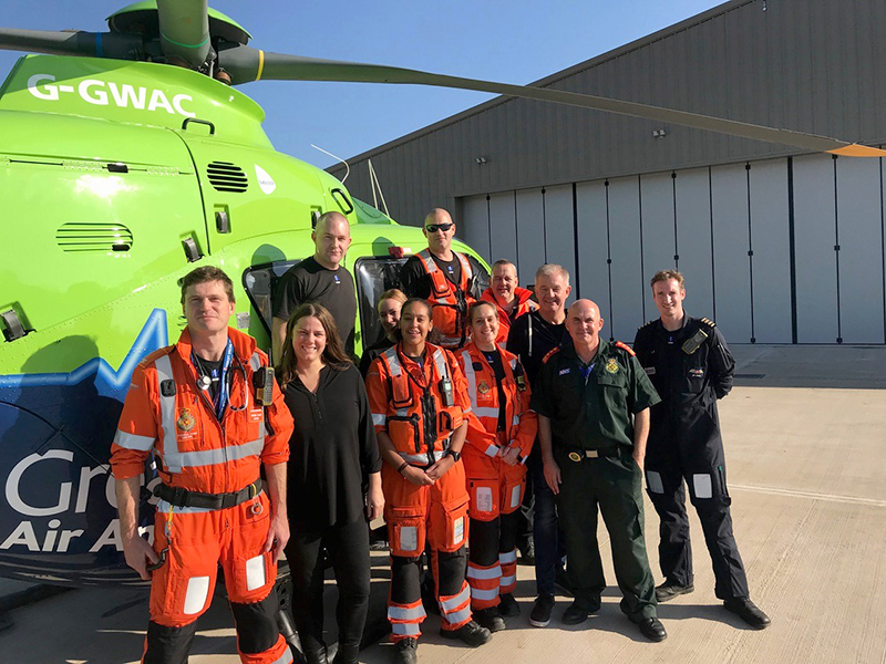Photo of GWAAC crew with air ambulance G-GWAC on the apron of the new Almondsbury air base