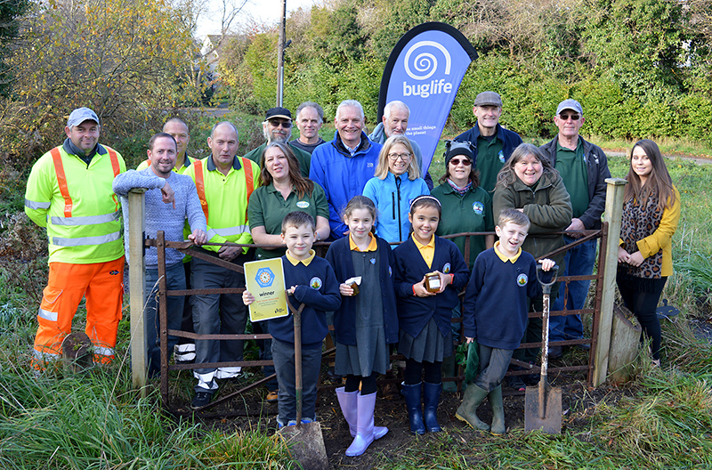 Photo of Cllr Paul Hughes with StreetCare staff, volunteers from Bradley Stoke Green Gym & Bradley Stoke in Bloom and children from Wheatfield Primary School.