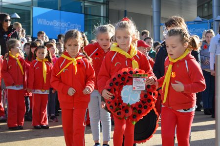 Photo of Rainbow Guides laying a wreath at the war memorial.