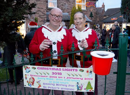 Photo of Mike Checkley (left) and Terry James standing at the gate to their house in Watch Elm Close.