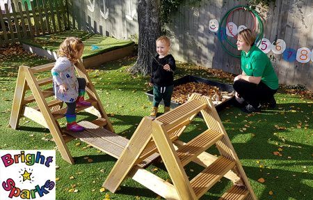 Photo of children playing in the garden during the toddler group session.