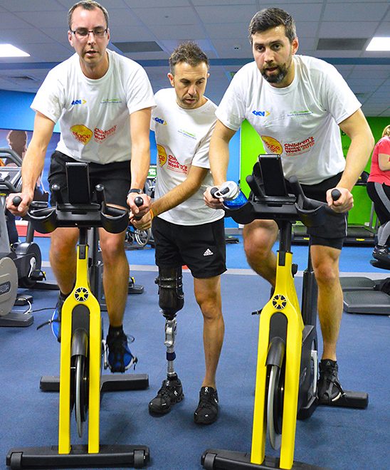 Photo of Paralympic gold medallist Andy Lewis MBE (centre) giving training advice to South Gloucestershire Council Cabinet members Cllr Jon Hunt and Cllr Toby Savage.