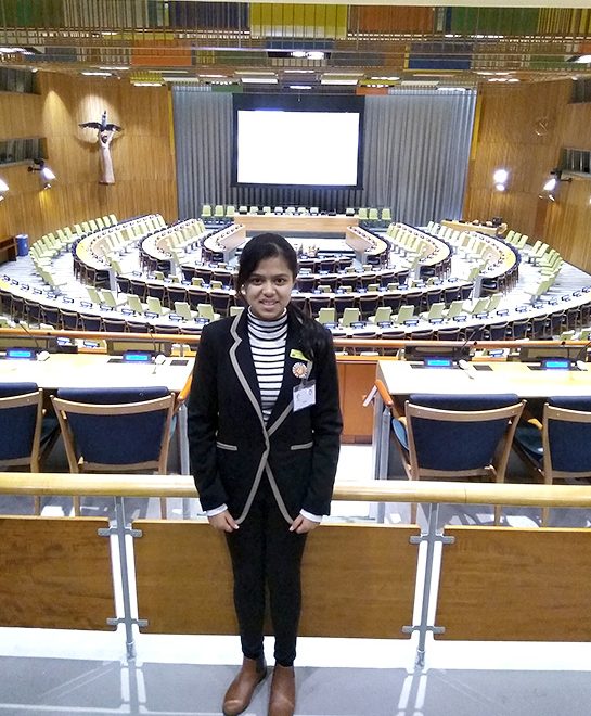 Photo of Khushi in the chamber of the Trusteeship Council.