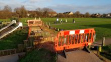 Photo of safety barriers at the site of the now-removed large wooden bridge.