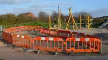 Photo of safety barriers surround the site of the now-removed teen shelter.