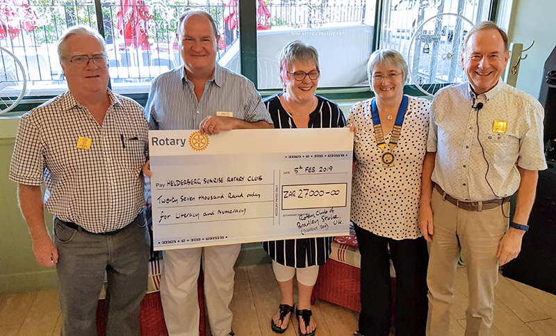 Photo of members of Bradley Stoke Rotary Club presenting a donation to a school in Cape Town