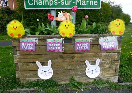 Photo of Easter decorations on a 'Welcome' planter.