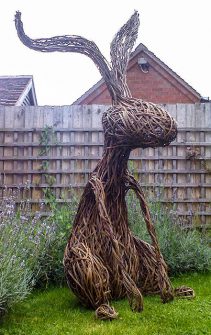 Photo of a large wicker rabbit created by sculptor Tom Hare.