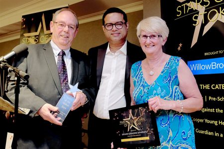 Photo of Ian and Geraldine Satherley with event host Paul Sinha.