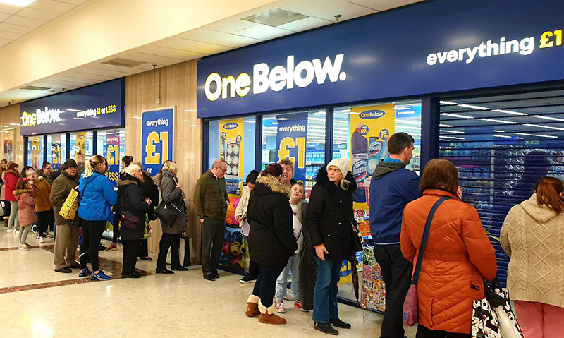 Photo of shoppers queuing outside a One Below store.