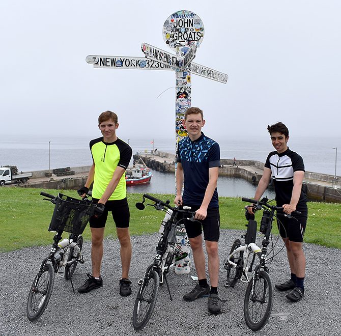 Photo of (l-r) Ryan Edwards, Scott Warburton and Alessandro Bufalino at John O'Groats.