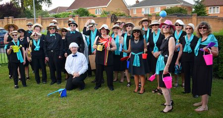 Photo of choir members pictured prior to their 2019 summer concert.