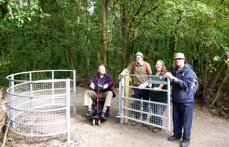 Photo of volunteers standing by the newly constructed disabled access gate into Savages Wood.