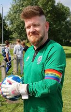 Photo of Darren Butt in a Hallen AFC shirt with captain's armband.