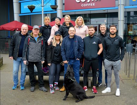 Photo of Matt Baggott (centre, with dog) and friends.