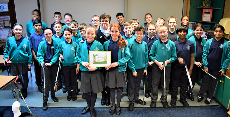 Photo of Cllr Erica Williams presenting winner’s certificates to the pupils.