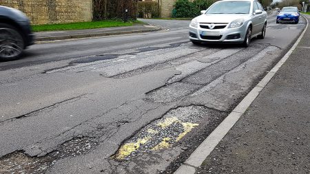 photo of potholes on Woodlands Lane.
