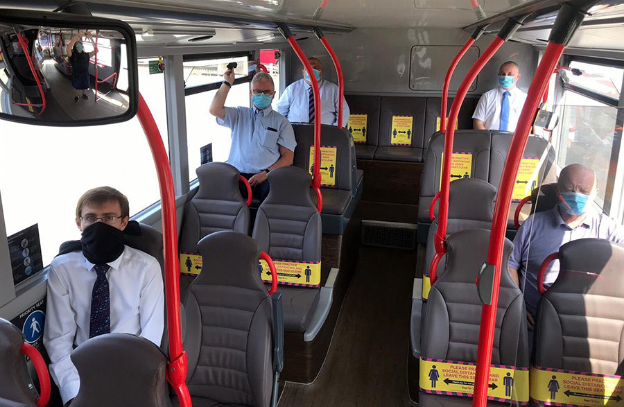 Social distancing on a First West of England bus. Photo of passengers socially distancing on the lower deck of a bus.