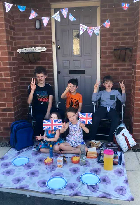 Photo of a doorstep VE Day party.