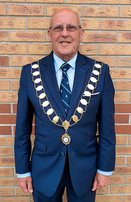 Photo of Cllr Tony Griffiths wearing the mayoral chain of office.