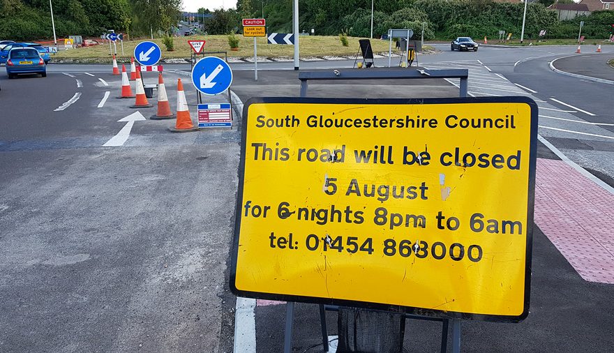 Photo of signage informing of a planned road closure.