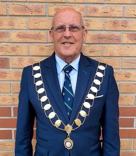 Photo of Cllr Tony Griffiths wearing the mayoral chain of office.