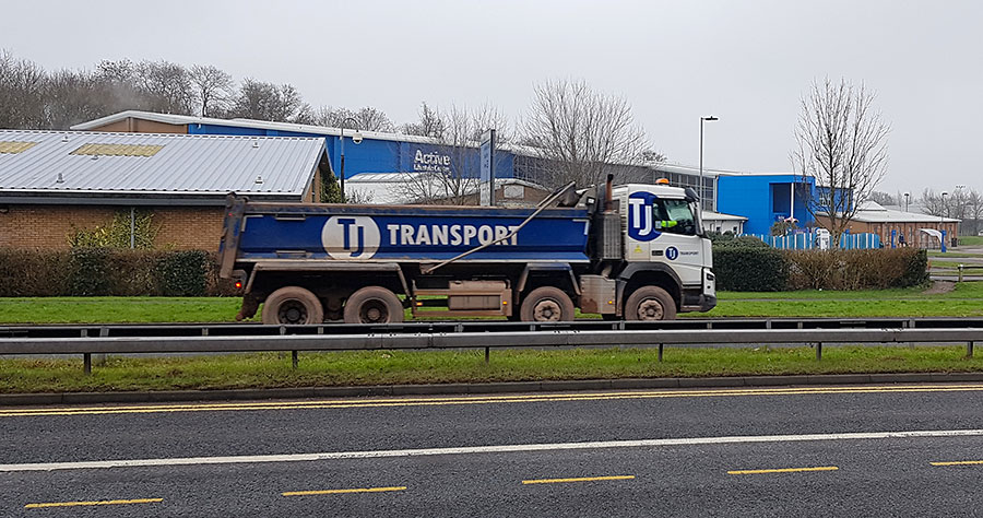 Photo of an empty tipper truck heading down Bradley Stoke Way.