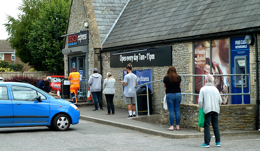 Photo of a socially distanced customer queue.