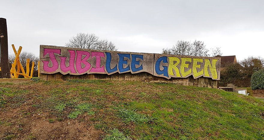 Photo of a sign spelling ut the words "Jubilee Green".