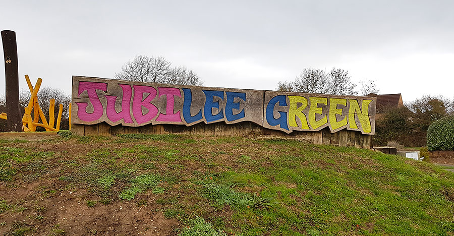 Photo of a sign spelling ut the words "Jubilee Green".