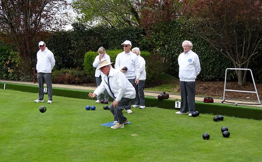 Photo of bowlers on a green.