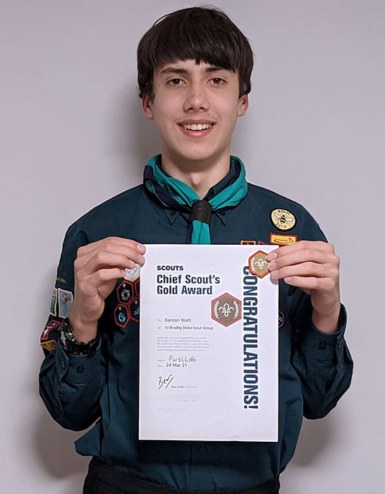 Photo of a Scout holding a certificate.