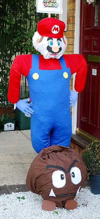 Photo of a scarecrow in the form of Super Mario.