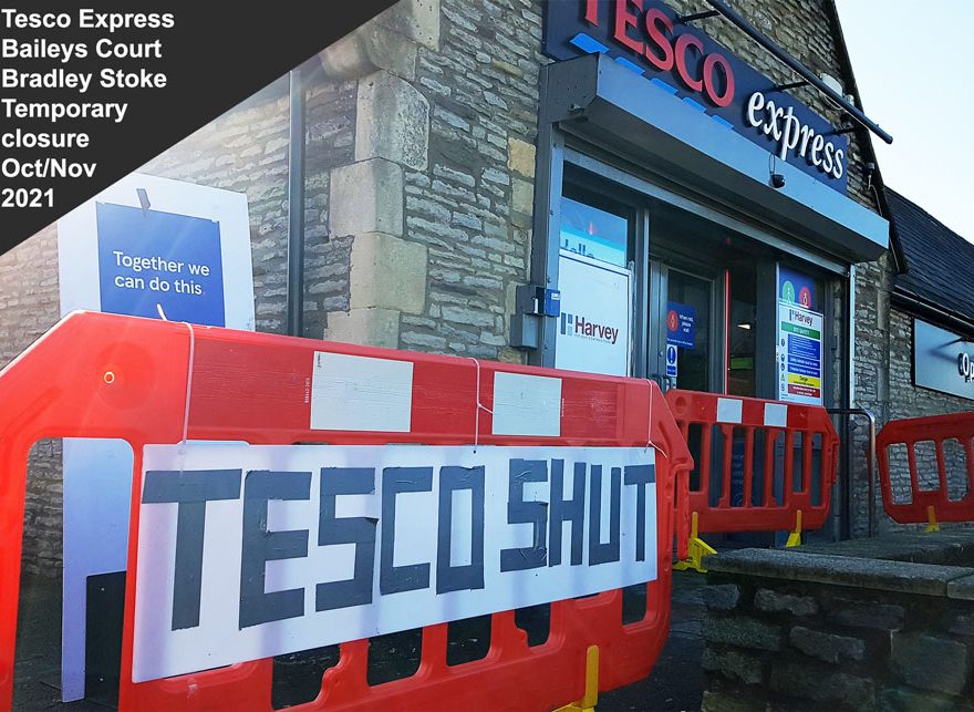 Photo of a large 'shut' sign in front of a shop.