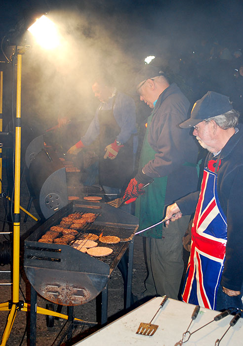 Photo of a line of barbecue grills.