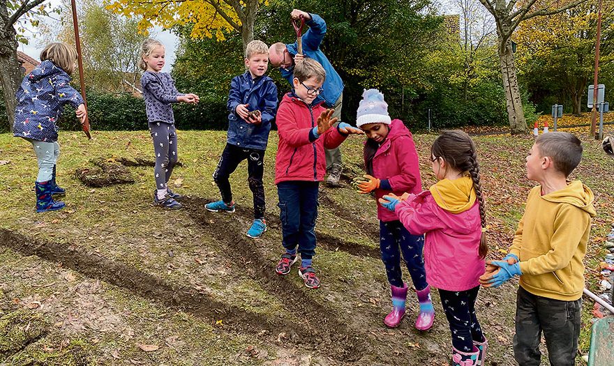 Photo of a line of young people.