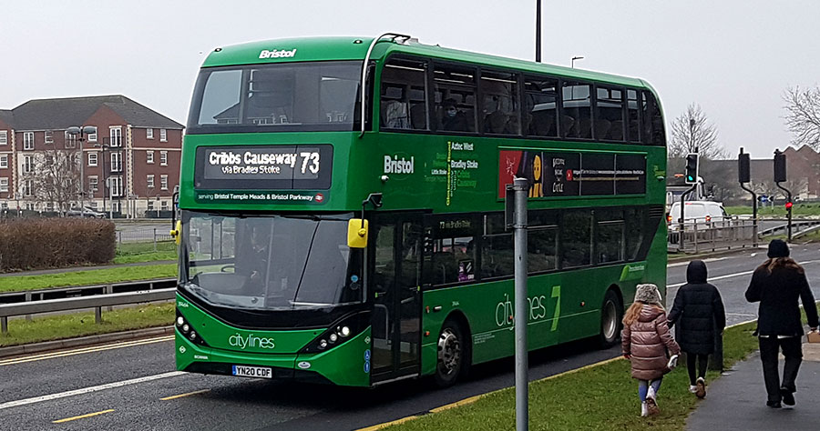 Photo of a green bus.