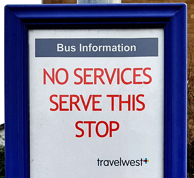 Photo of a sign at a bus stop.