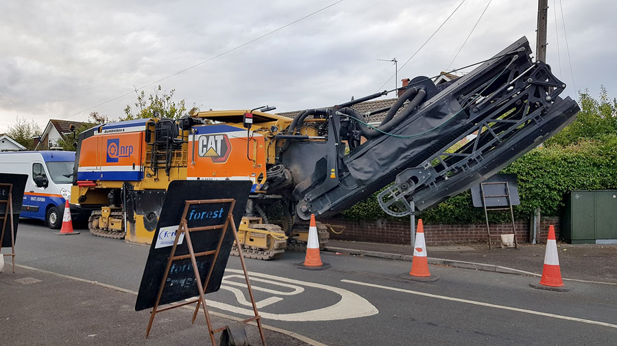 A road milling machine parked up in Stokemead during resurfacing works on Stoke Lane in September 2022. Photo of a road milling machine.