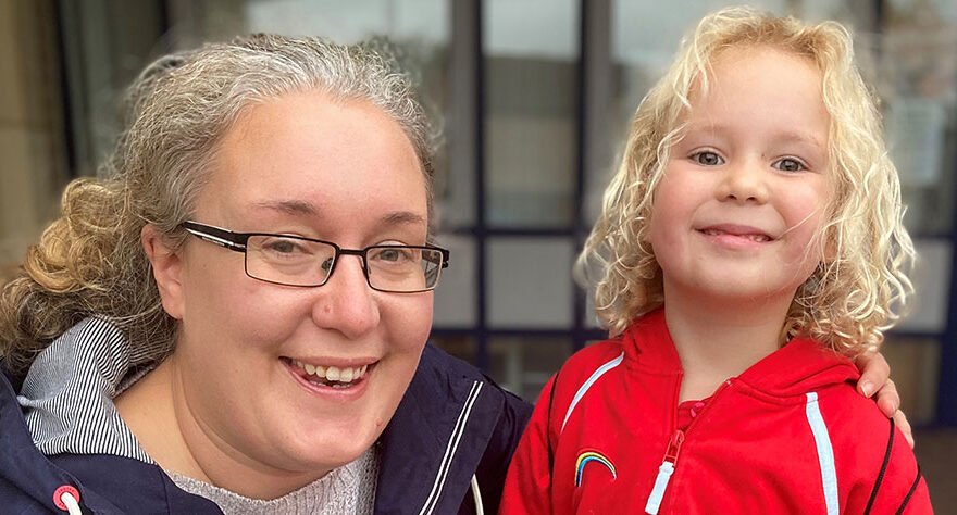 Photo of a Rainbow Guide with her mum.