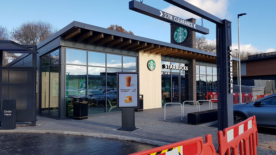 Photo of a Starbucks restaurant nearing completion.