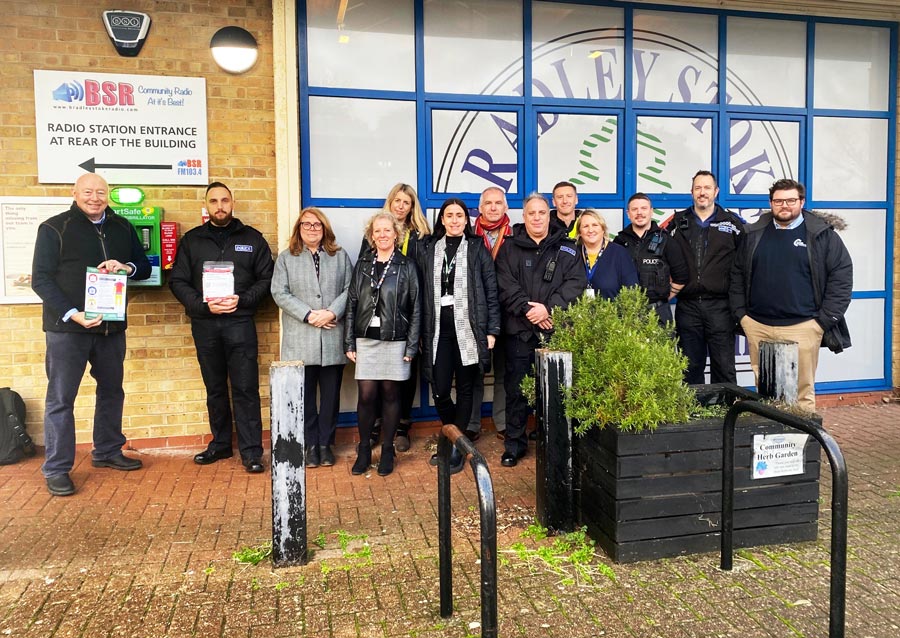 Chief Inspector Mike Vass (2nd from left) with HeartSafe, Deputy PCC Claire Hiscott (third from left), councillors and officers at the bleed kit launch. Photo of a group of people standing near a bleed kit mounted on the wall of a building.