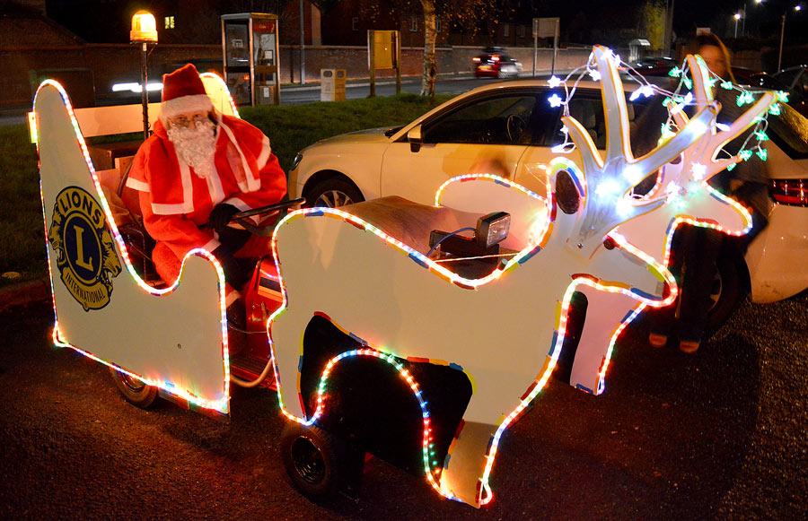 Bradley Stoke Lions' Santa sleigh. Photo of Santa sitting on a motorised sleigh.